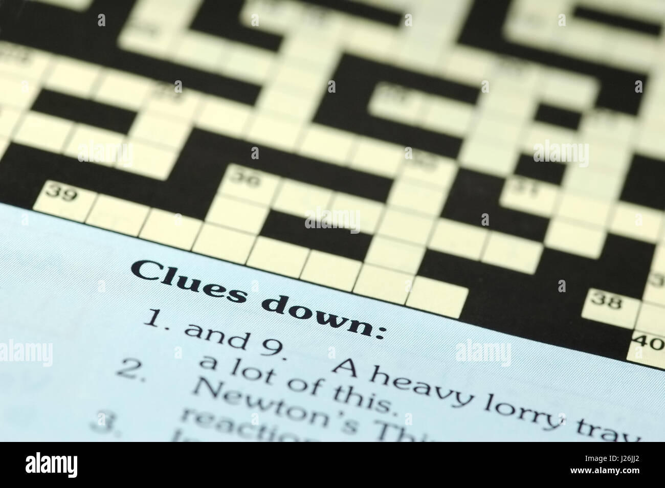 Crossword Puzzle Closeup With Clues Down Stock Photo Alamy